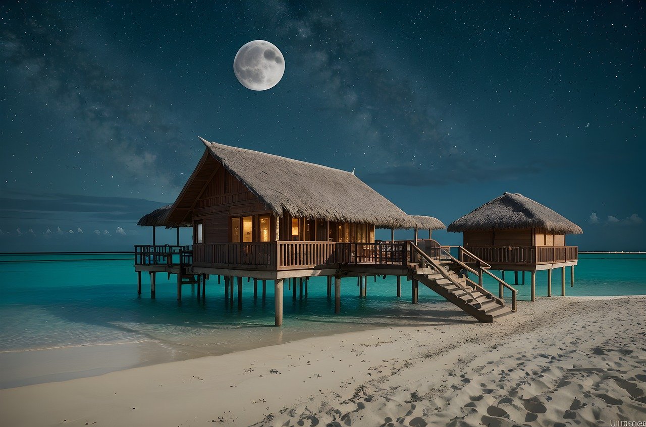 Wasserbungalow auf den Malediven bei Nacht